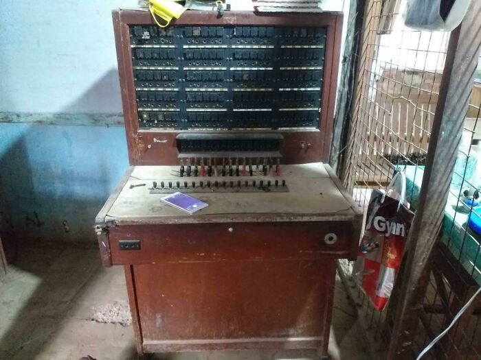 A Modern Smart Phone On A Vintage Telephone Operator Booth From A Small Town Of A Third World Country