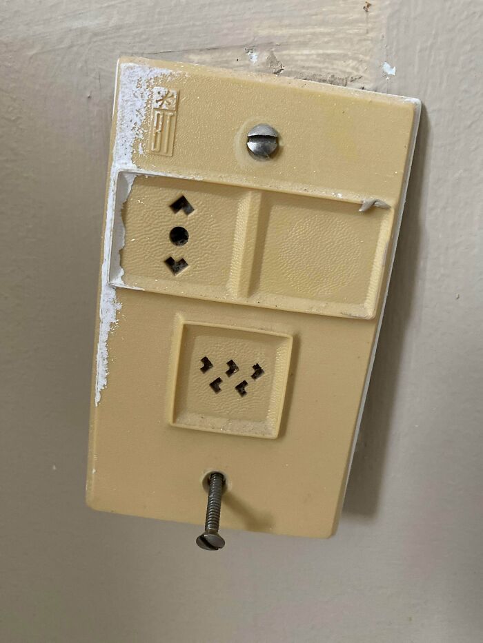 Two Plugs On This Outlet, Not Sure What Either Of Them Are For! Found In Master Bedroom Of A House Built In Late 1970s