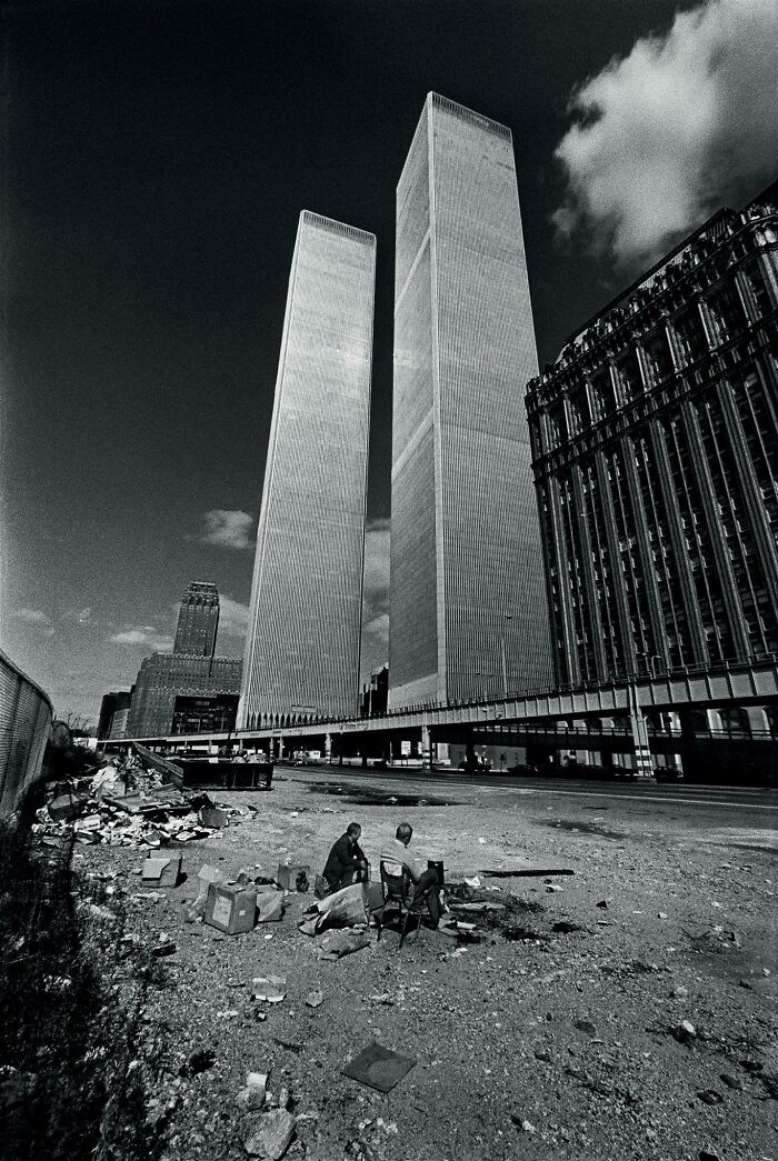 Two Homeless Men Squat In The Shadow Of The Recently Completed World Trade Center In 1975...