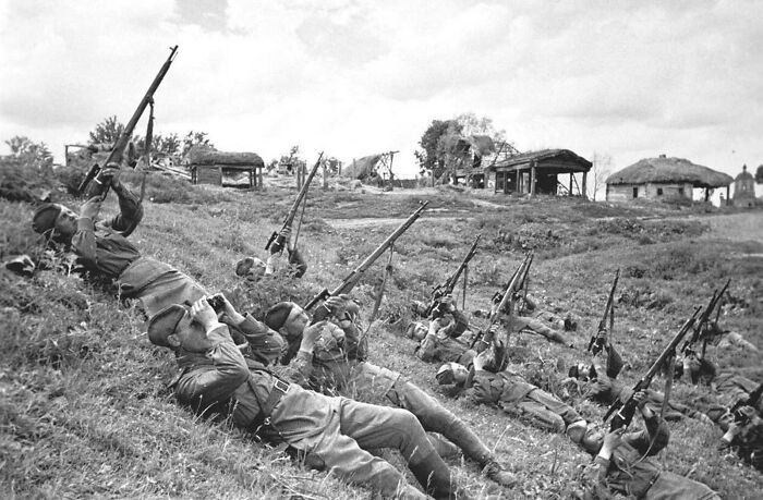 Soviet Soldiers, On Their Backs, Launch A Volley Of Bullets At Enemy Aircraft In June Of 1943