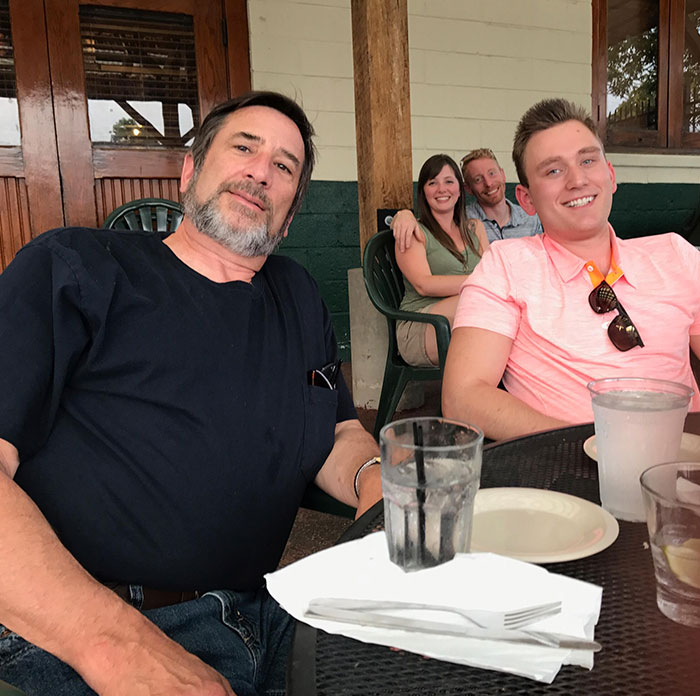 Photobombed By The Couple Behind My Father And I