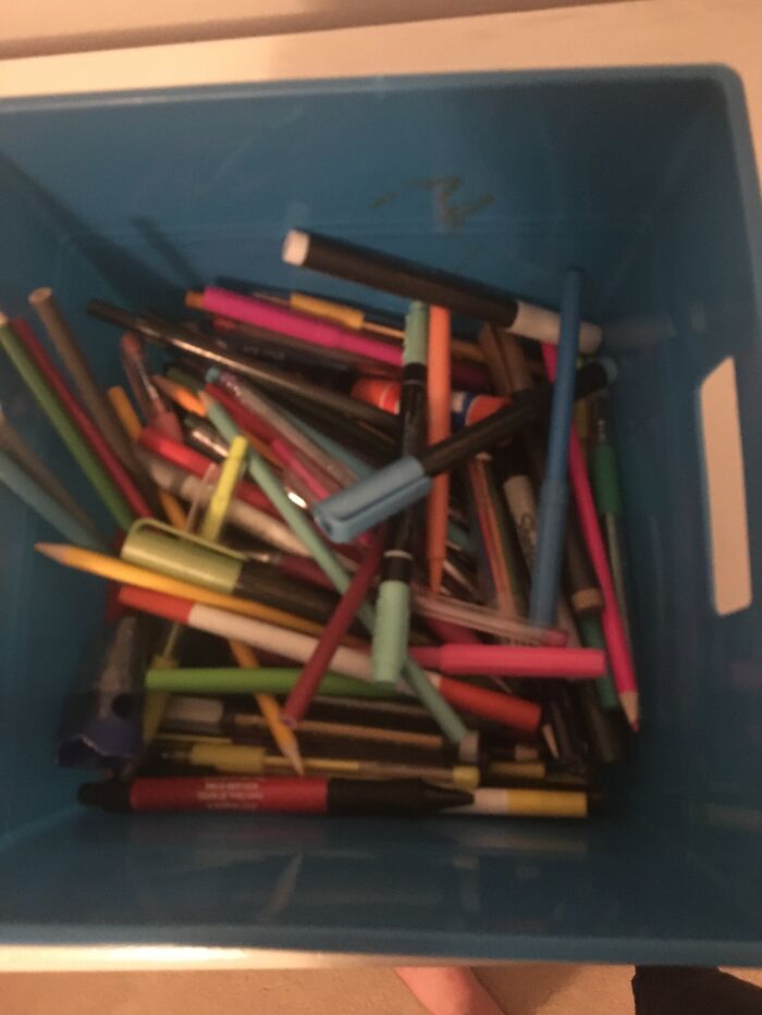 Writing Utensils, Chapstick, And Sunglasses.