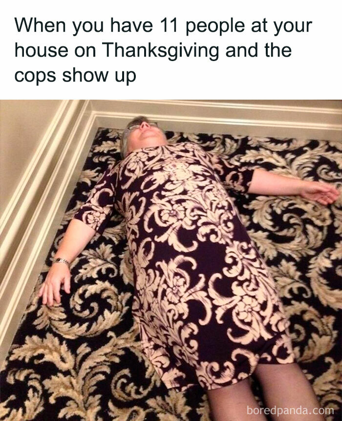 Person lying on a patterned carpet, overwhelmed during Thanksgiving social distancing.