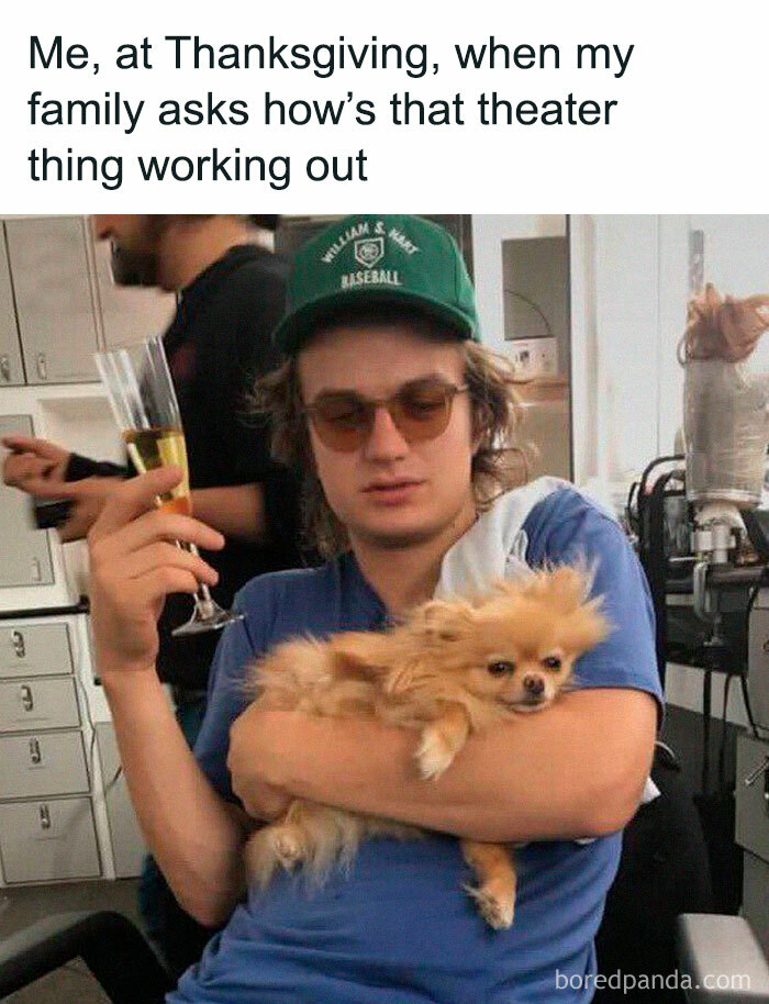 Person holding a Pomeranian and a glass of champagne, wearing sunglasses and a baseball cap. Text about Thanksgiving theater question.