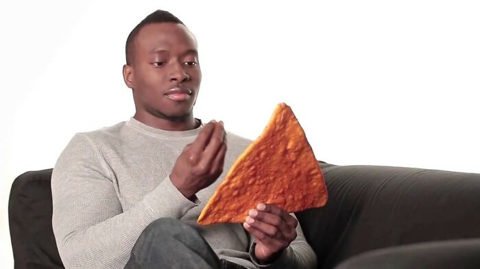 An Italian Having A Conversation With A Giant Nacho