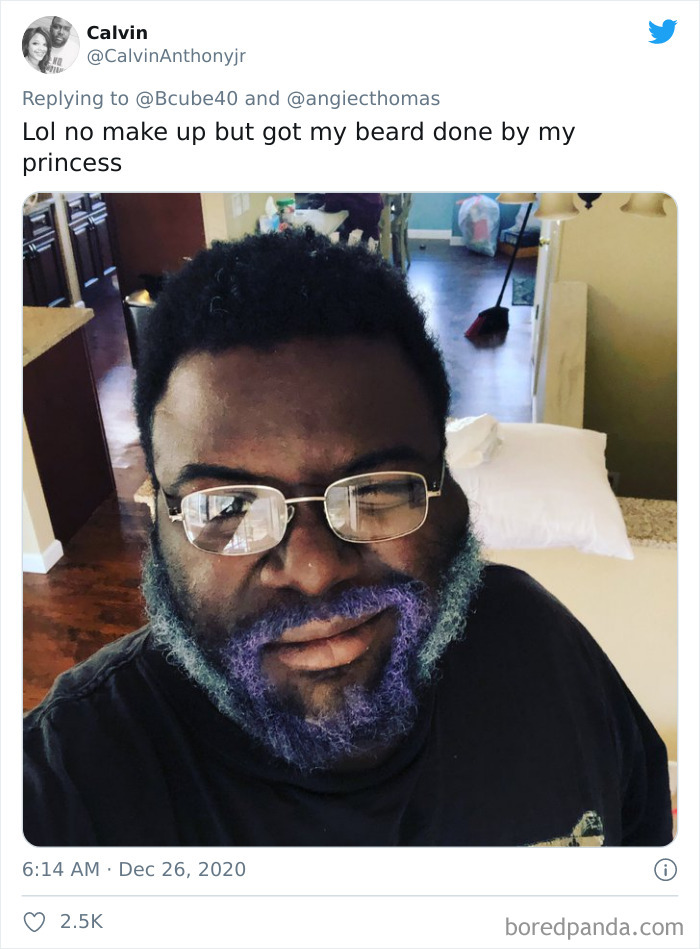 Man with colorful dyed beard smiling after a visit to his daughter's beauty salon, showcasing playful results.