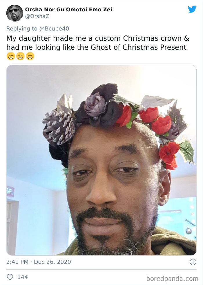 Man wearing a festive flower crown made by his daughter, showcasing a dad's look after visiting his daughter's beauty salon.