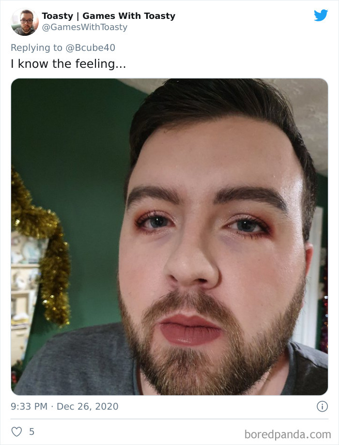 Man with makeup on his face after a humorous visit to his daughter's beauty salon, showing a funny transformation.