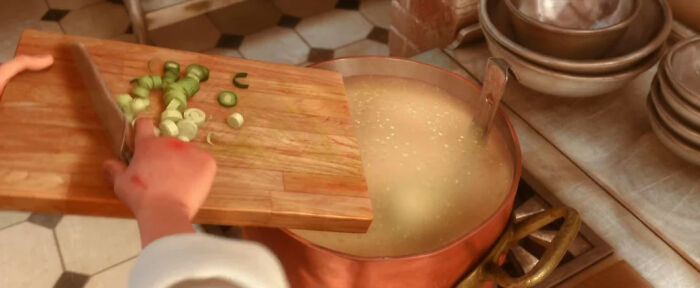 When Linguini Is Chopping Leeks For The Soup You Can See A Green Smear On The Cutting Board That Actually Happens When Cutting Green Vegtables. Also His Bite Marks Are Still There From When Remy Bit Him A Couple Of Days Before