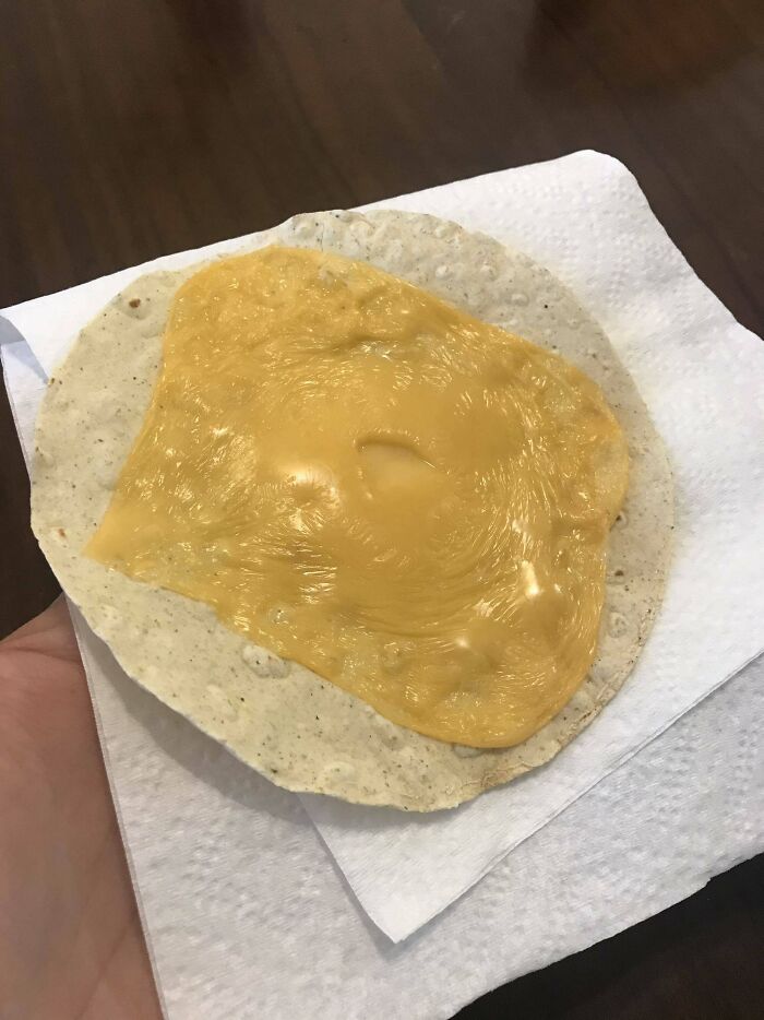 I Wanted Nachos So I Microwaved Kraft Singles On A Tostada