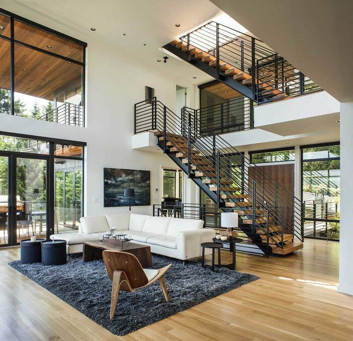 Double-Height Sitting Area Near The Main Stairwell In This Home Located In Portland, Oregon