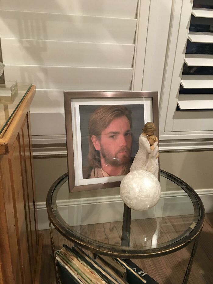 Portrait resembling Obi-Wan Kenobi in a frame on a table, mistakenly hung by Mormon parents thinking it’s Jesus Christ. Portrait resembling Obi-Wan Kenobi in a frame on a table, mistakenly hung by Mormon parents thinking it’s Jesus Christ.