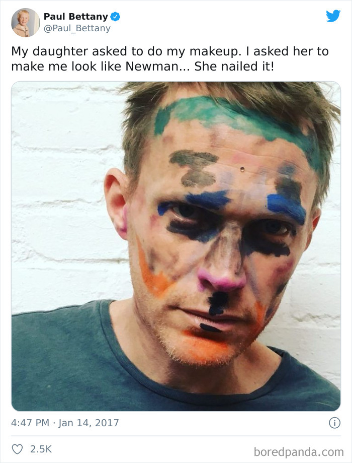 Man with colorful makeup drawn on his face by daughter, showing dads after a visit to their daughters' beauty salons.