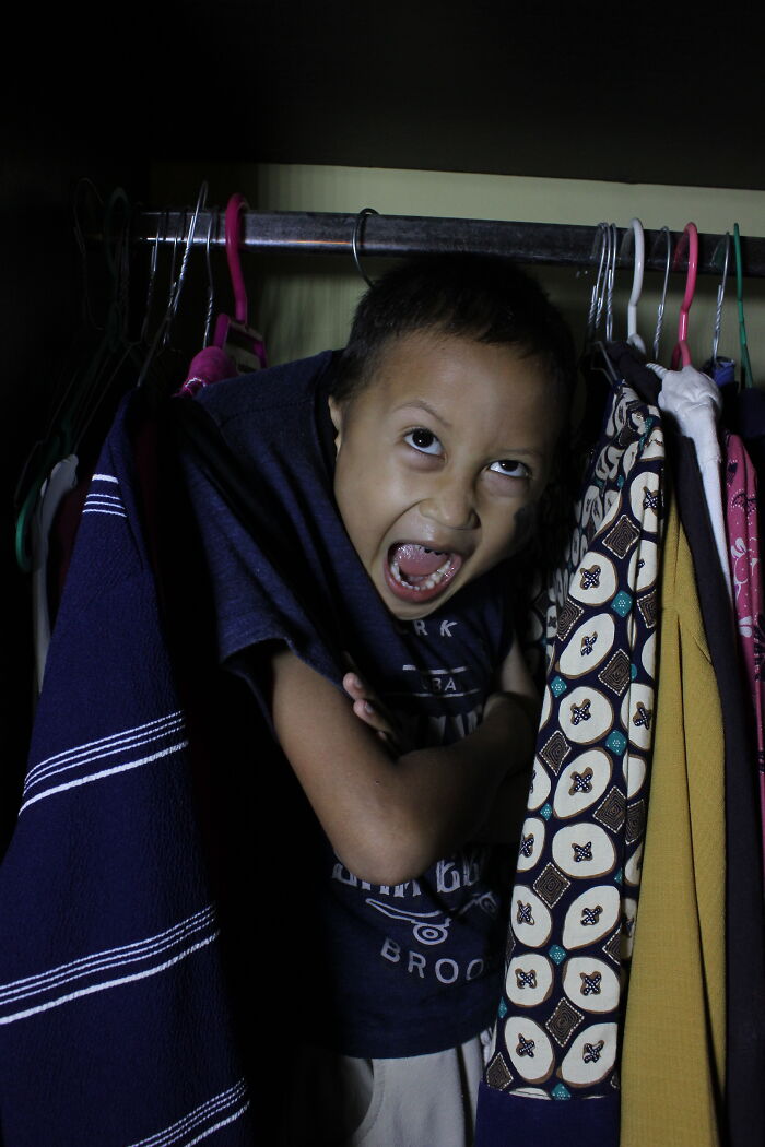 A Boy Hung On Clothes Hangers