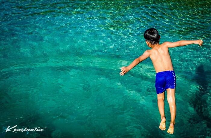 A Local Kid In Roatan, Honduras Enjoying Day Off From School.