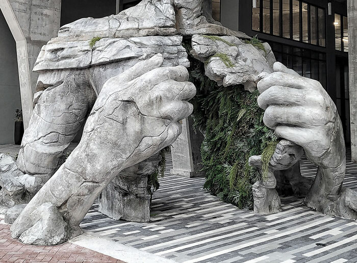 Giant Sculpture Of A Woman Opening Her Chest To Reveal A Fern-Covered Tunnel Appears In Florida