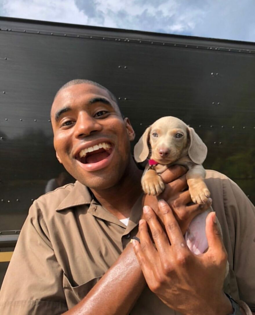 Delivery Man Continues To Take Breaks On The Way To Take Pictures And Pet The Dogs He Meets (New Pics)