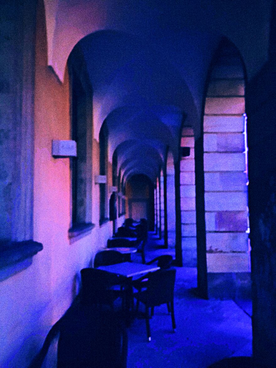 When I Took The Photo Everything Was Bathed In A Purple-Blue. A Very Popular Crowd Puller In A City In Germany. (Fulda) Ice Coffee And Bistro In Summer, Warm Cozy Meeting Place In Winter With Coffee, Tea, Hot Chocolate And A Beautiful View, In The Middle Of The Old Town. Now In A Worldwide Standstill, Lonely Place, With The Weatherproof Tables And Chairs ... Outside ...