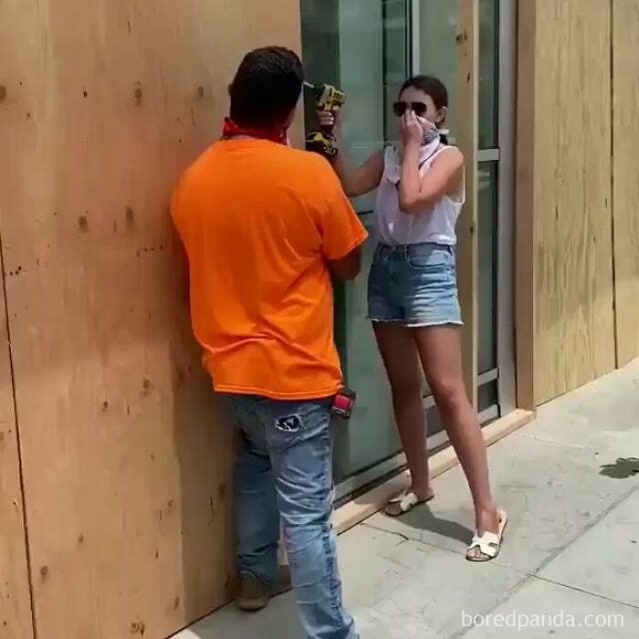 Santa Monica Woman Pretends To Board Up Windows Using A Worker's Drill For A Photo Then Drives Off In A Mercedes