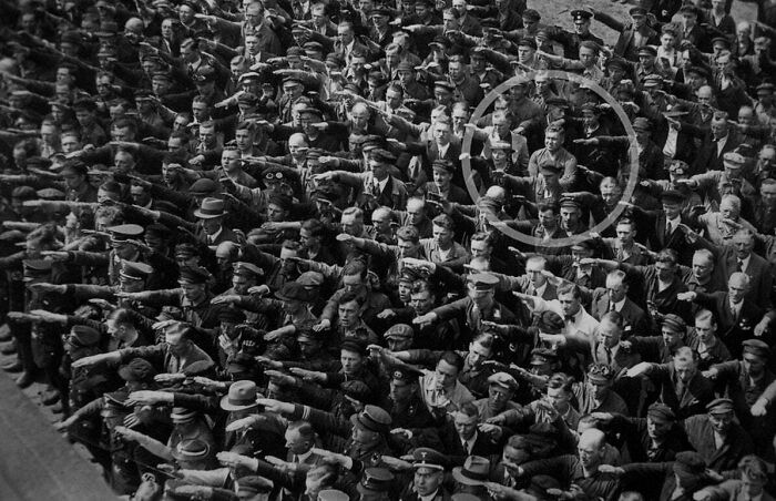 August Landsmesser Being The Only One Not To Give The Nazi Salute At A 1936 German Rally. He Was Later Sent To A Concentration Camp For Publicly Having A Relationship With A Jewish Woman