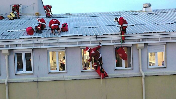 Serbian Mountaineers Deliver New Year's Presents To Kids In Belgrade University's Children's Hospital