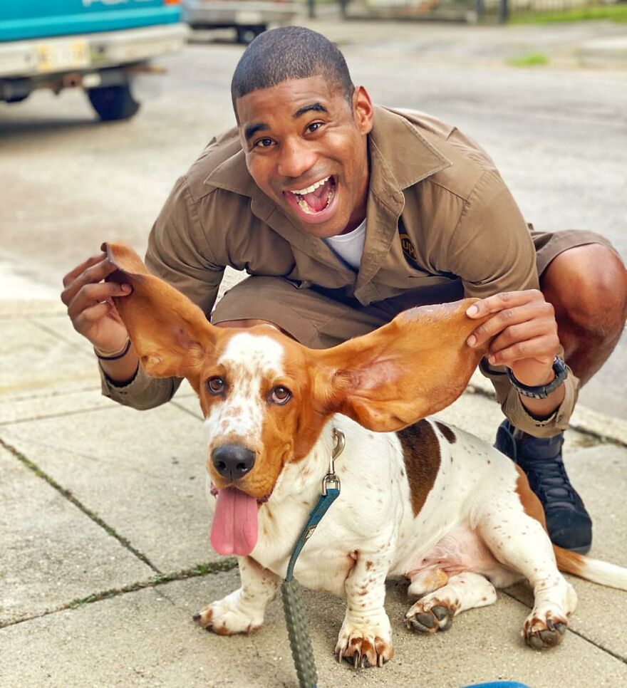 Delivery Man Continues To Take Breaks On The Way To Take Pictures And Pet The Dogs He Meets (New Pics)