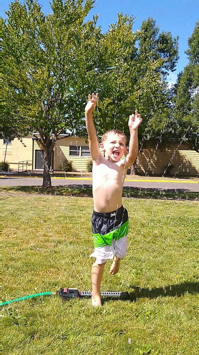 My 4 Year Old Running Through The Sprinklers.