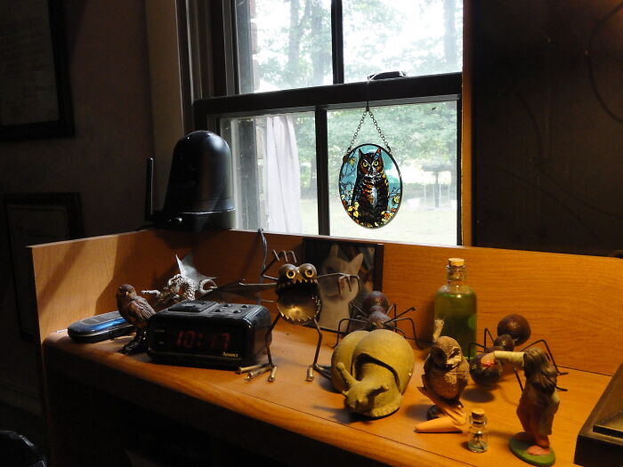 Some Of My Toys On The Shelf Of My Computer Desk