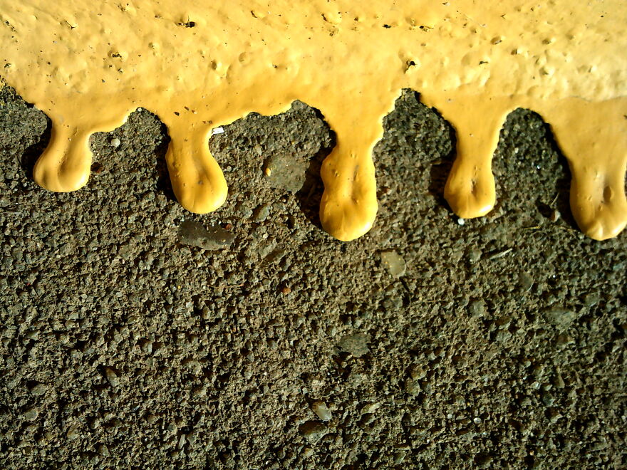 I Took This Picture On The Side Of My School. It's Paint That Dripped Down The Side Of The Curb