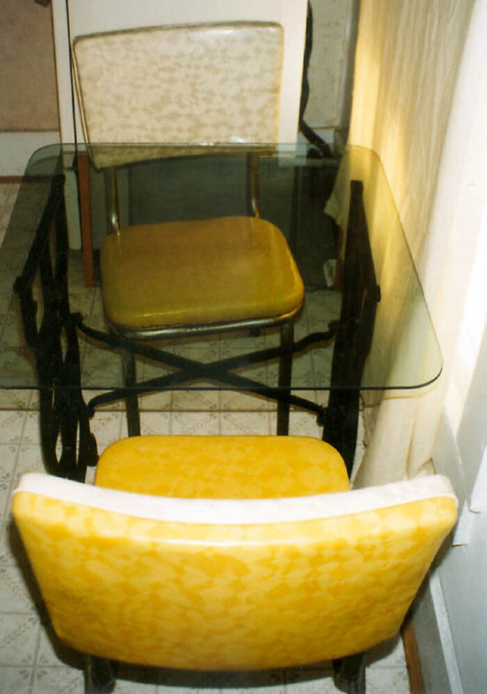 Glass Top Kitchen Table. Pair Of Chairs From Yard Sale: $5, Treadle-Powered Sewing Machine Base From Yard Sale: $5, Glass Table Top Rescued From Dumpster, One Tube Of Gel Super Glue From Dollar Store. Total Cost: $11.