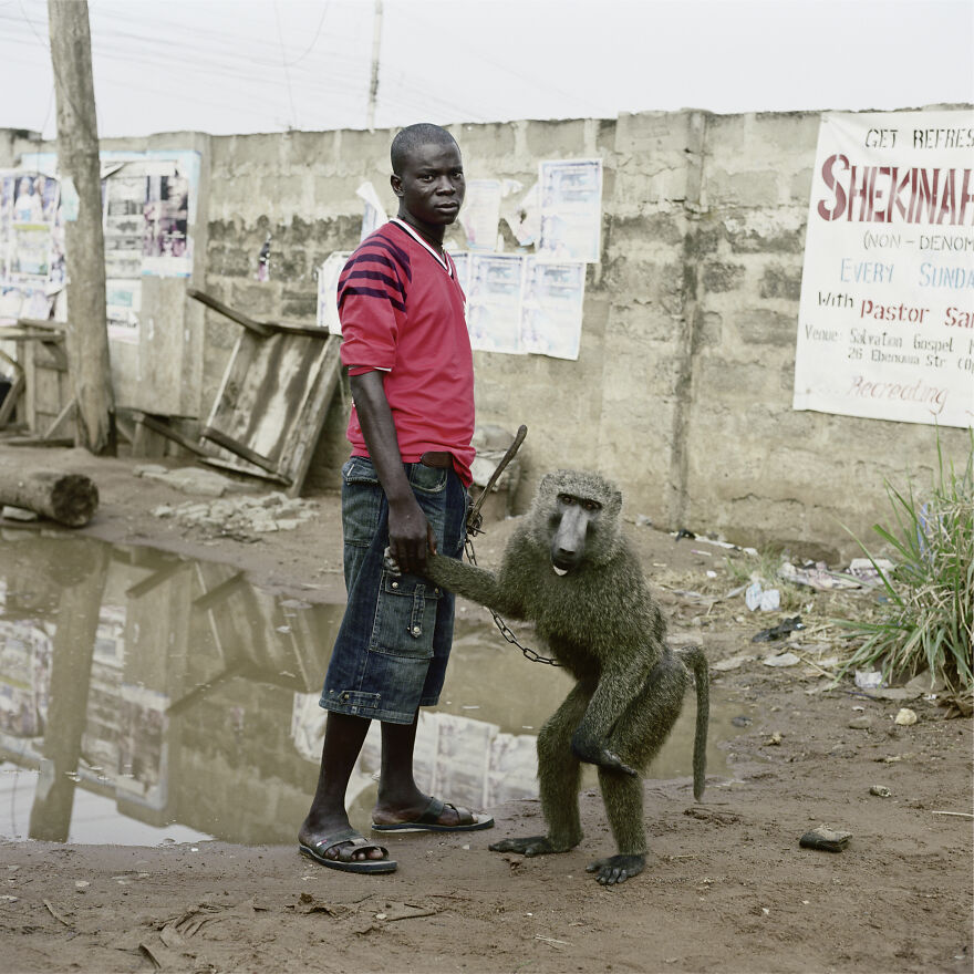 Umoru Murtala With School Boy, Asaba, Nigeria, 2007, "The Hyena And Other Men"