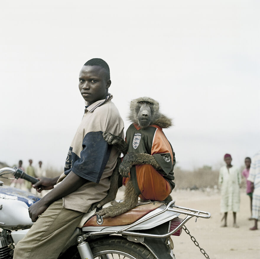 Motorbike Rider With Amiloo, Nigeria, 2005, "The Hyena And Other Men"