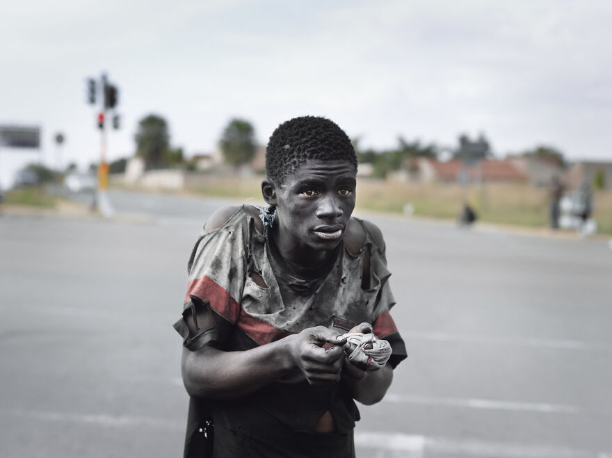 At A Traffic Intersection, Johannesburg, 2011, "Kin"