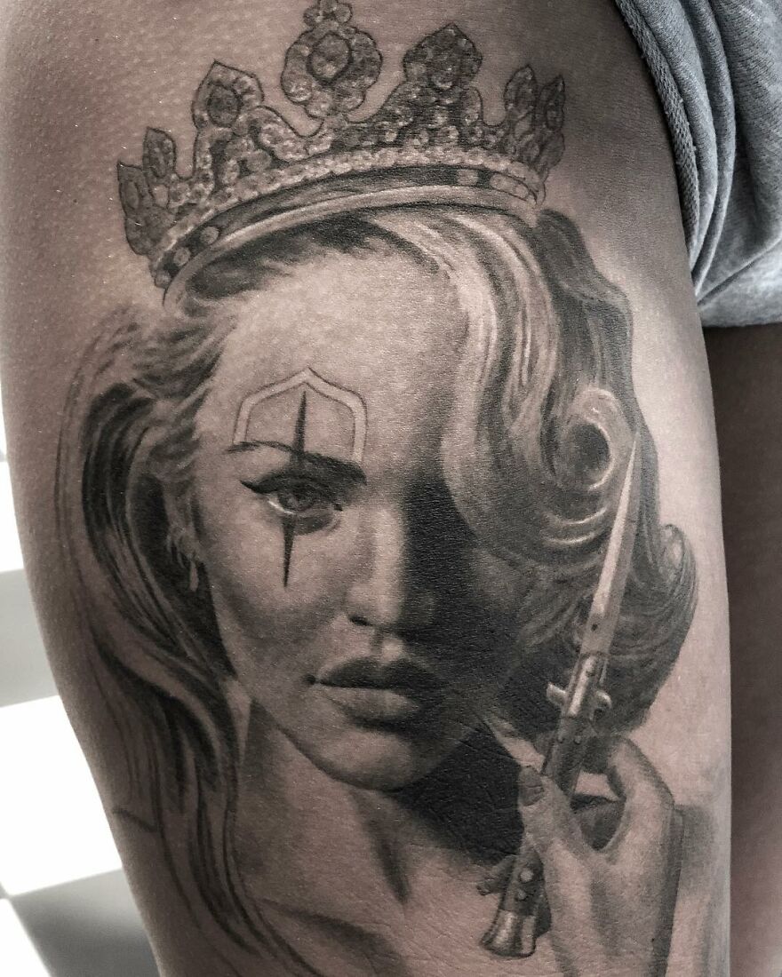 Black and gray realism tattoo of a woman with a crown and dagger, created by a Swedish artist.