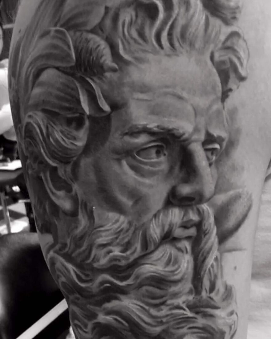 Black and gray realism tattoo of a bearded man by a Swedish artist.