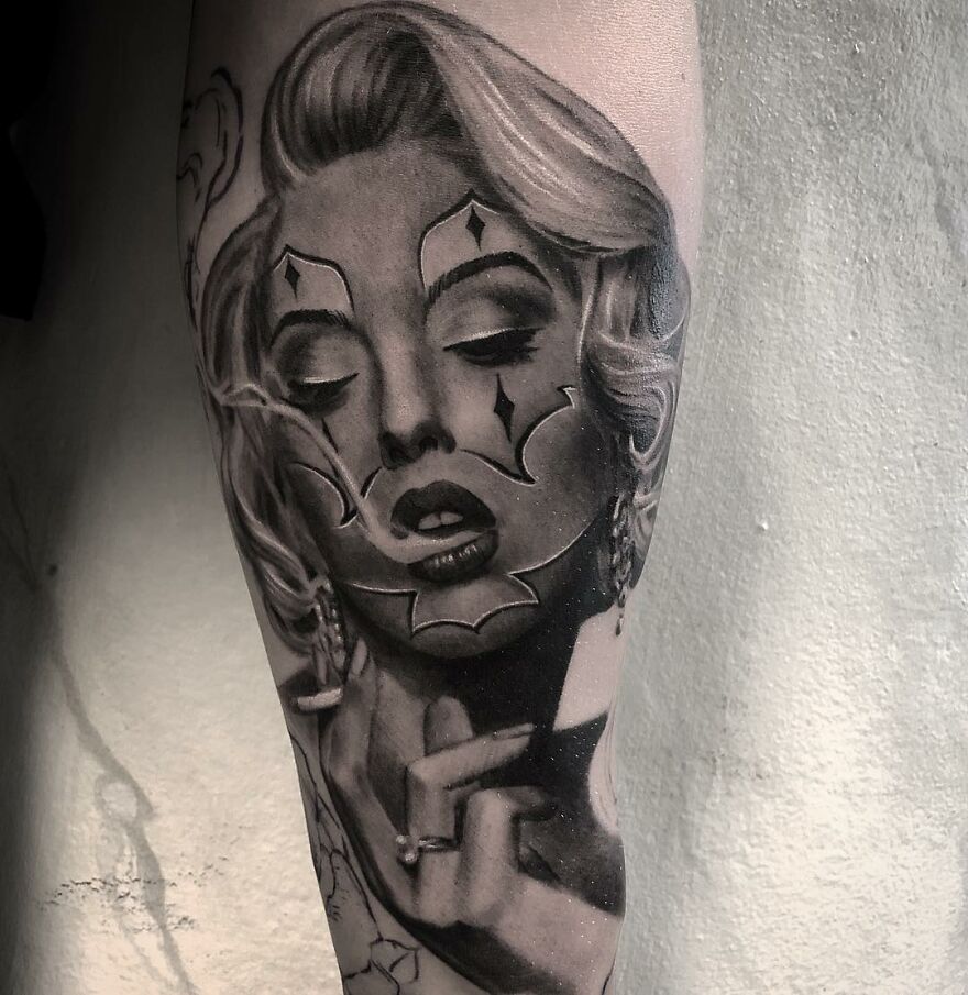 Tattoo of a woman's face in black and gray realism style by Swedish artist, featuring elegant detail and shading.