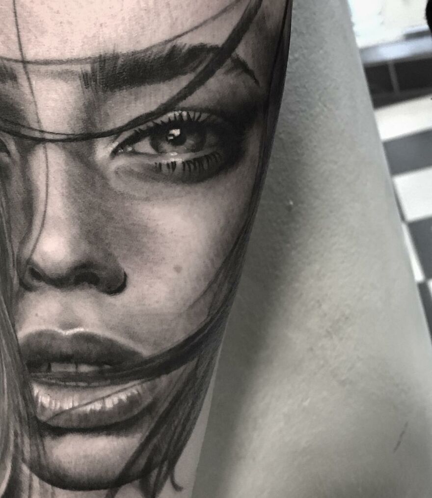 Black and gray realism tattoo of a woman's face by a Swedish artist, showcasing detailed and impressive artistry.
