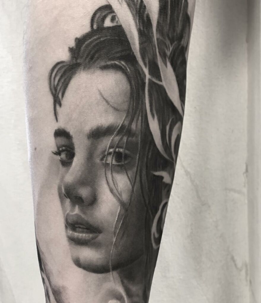 Black and gray realism tattoo of a woman's face by Swedish artist, showcasing intricate details and shading.