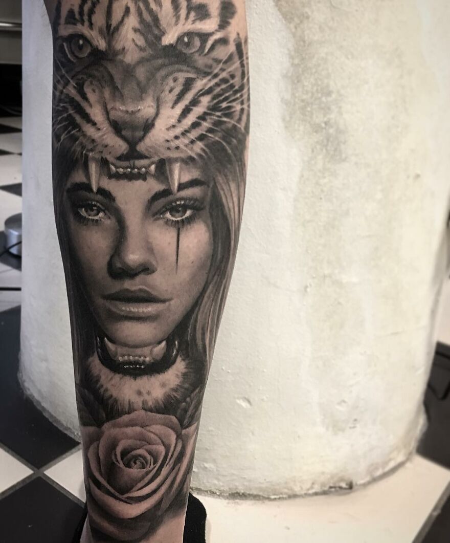 Black and gray realism tattoo of a woman, tiger, and rose on a leg by a Swedish artist.
