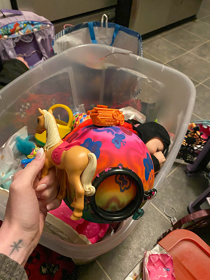 I’m Helping My Mom Clean Out My Little Sister’s Room And We Found This Ball With Toys Glued To It
