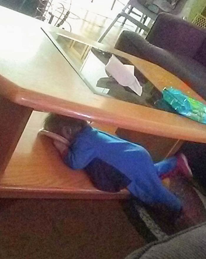 My Daughter Is Weird. Here Is A Picture Of Her Laying Under The Coffee Table While Blowing Raspberries Into A Paper Plate