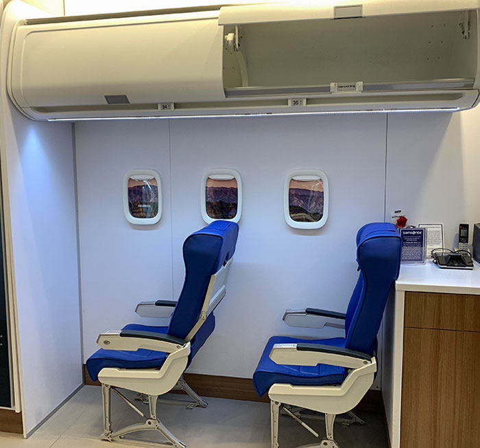 This Luggage Store Has An Airplane Set Up For Customers To Test Their Carry-Ons And Underseater Bags