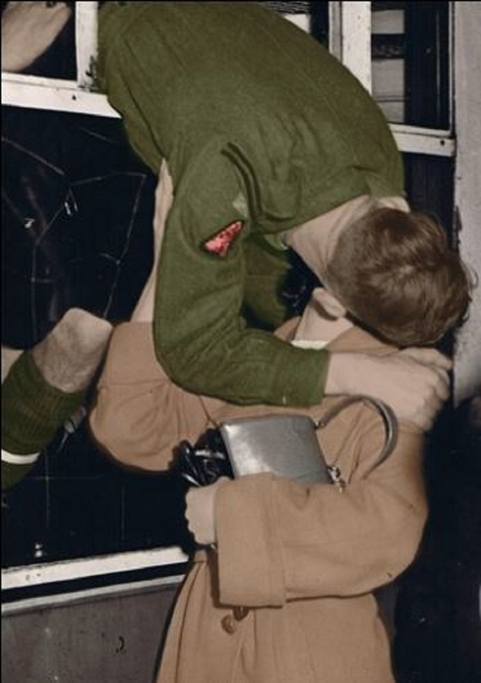 My Grandad Hanging Out A Train Window To Catch A Kiss From My Granny In The 1950's. Photo Was Colourised A Few Years Back.