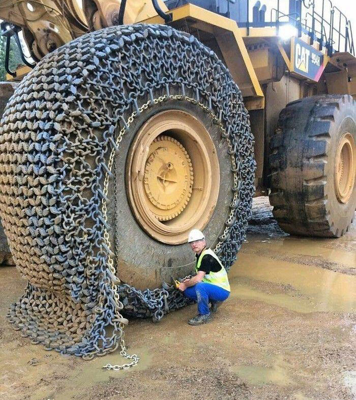 This Is A Protective Chain Against Sharp Fragments Of Debris Compared To A Worker