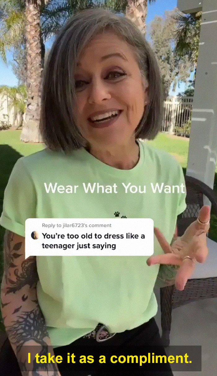 Woman in her 50s confidently responding to being told she's too old to dress like a teenager with her outfit. Woman in her 50s confidently responding to being told she's too old to dress like a teenager with her outfit.