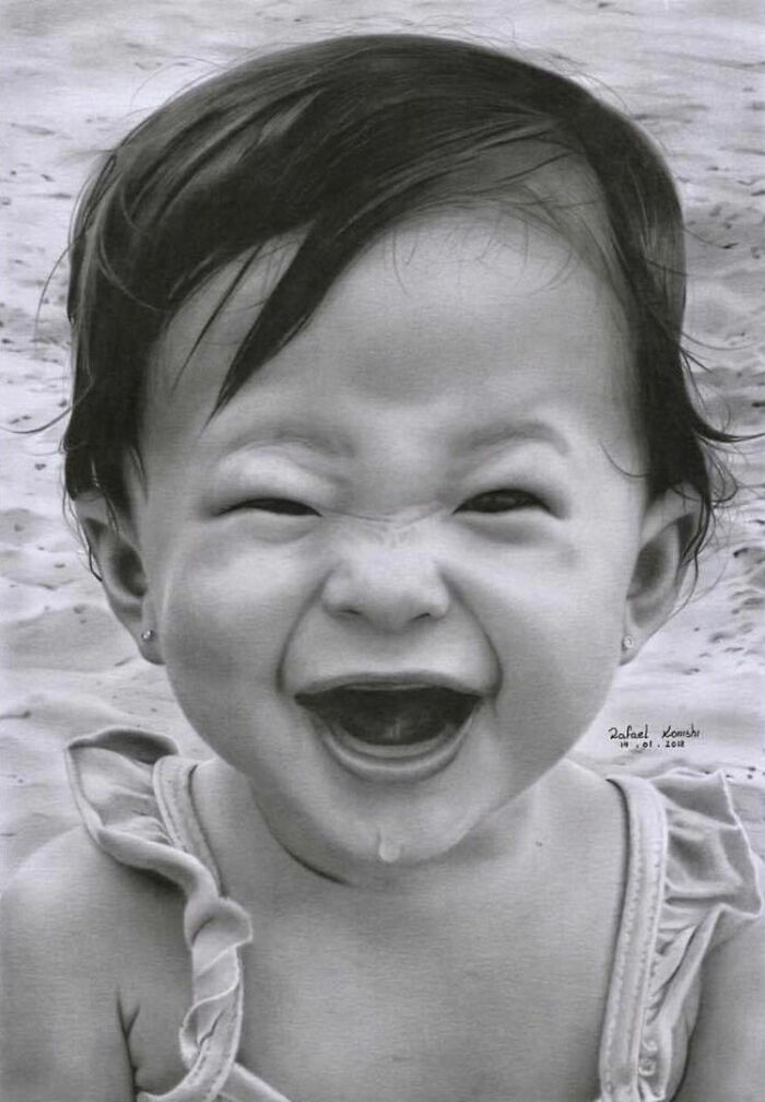 Realistic drawing of a happy baby by artist Rafael Konishi, showcasing intricate detail and lifelike expression.