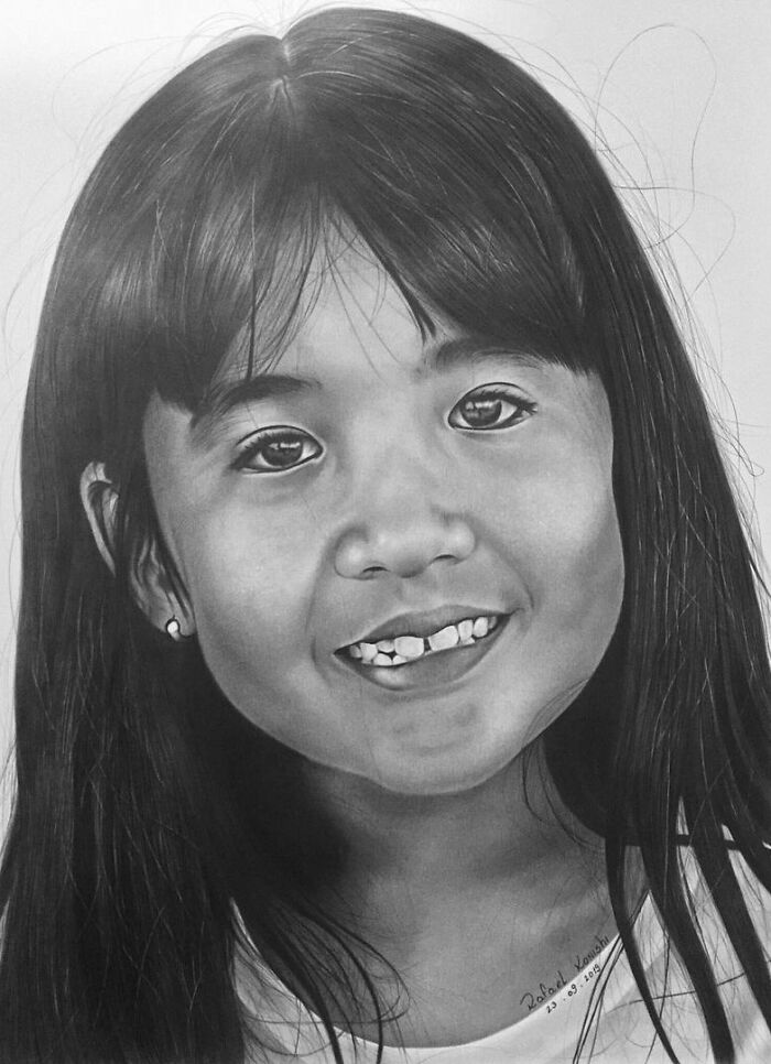 Realistic drawing of a young girl smiling by artist Rafael Konishi.