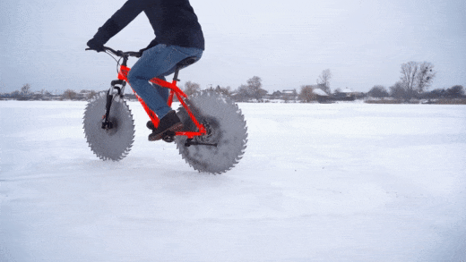 Man Replaces Bike Tires With Circular Saws And Goes For A Spin On A Frozen Lake Man Replaces Bike Tires With Circular Saws And Goes For A Spin On A Frozen Lake