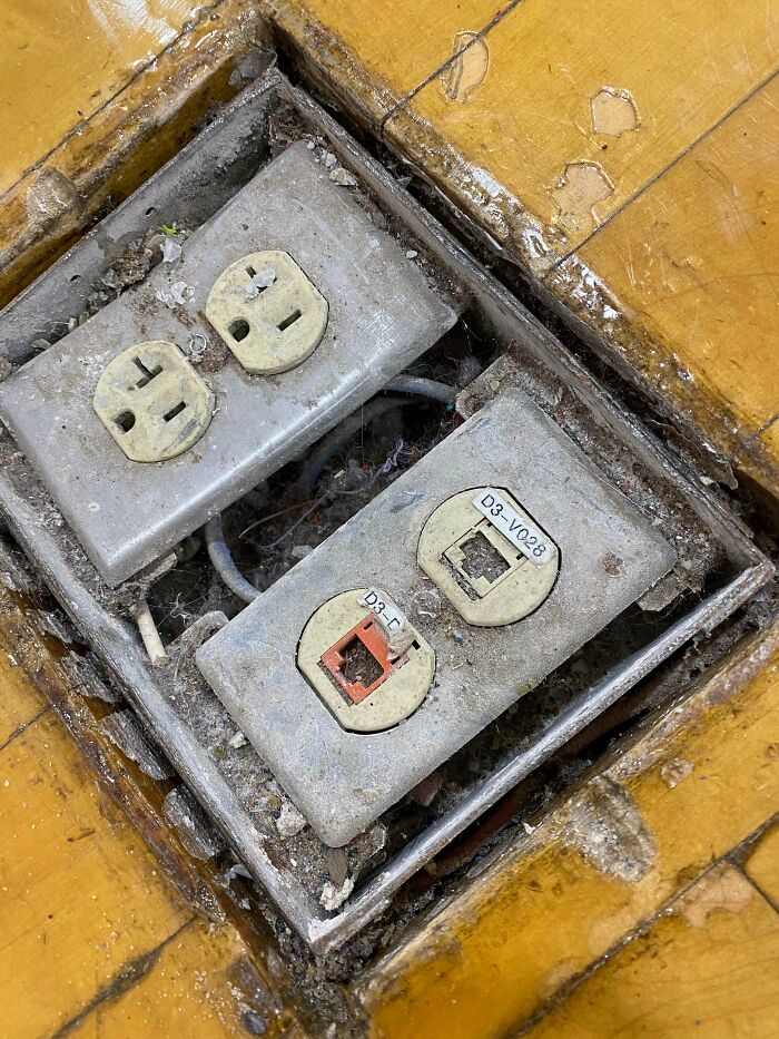 Just Checking Where I Can Plug In My Laptop. Middle Of A Gym Floor. Multiple Coats Of Sealant And Many Layers Of Dust