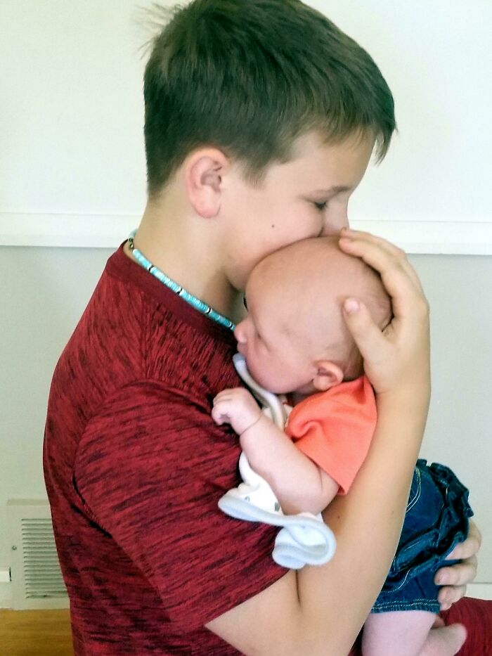 My Son Has Very Little Experience With Babies But Wanted To Keep Trying Ways To Get Her To Stop Crying. Surprised At The Silence I Returned To The Room To See Him Bouncing Gently On An Exercise Ball, Totally Pleased With Himself